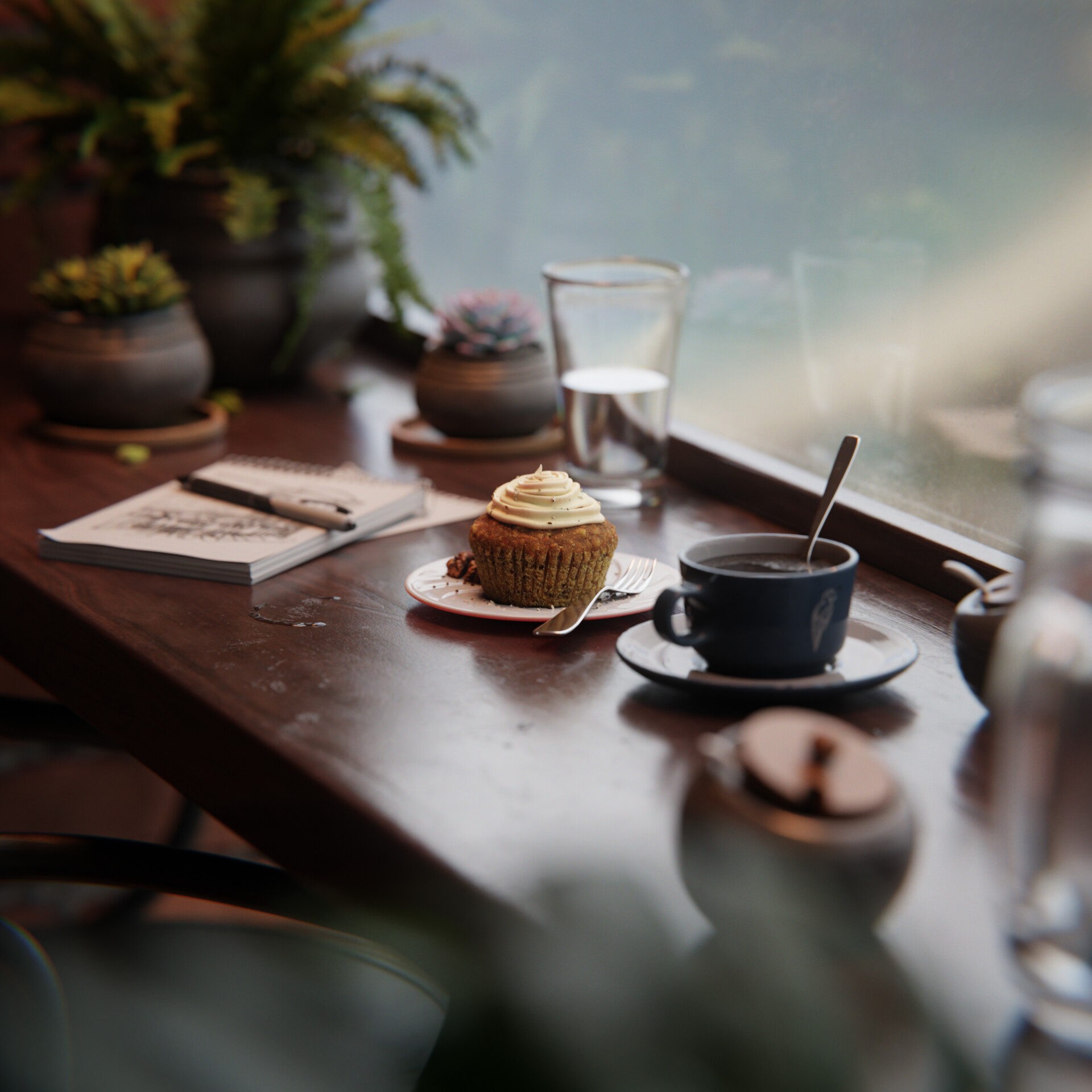 Urgent: a cup, cupcake, glass, and sketchbook on a wood table beside a softly lit window.